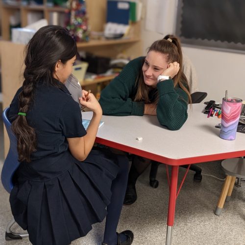 grade three student connecting with teacher
